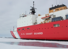 A U.S. Coast Guard vessel breaking through ice. 