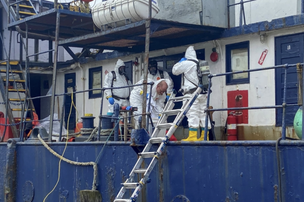 U.S. Coast Guard crews work with contractors to ensure all fuel, oil, and hazmat materials were removed from derelict vessel. 